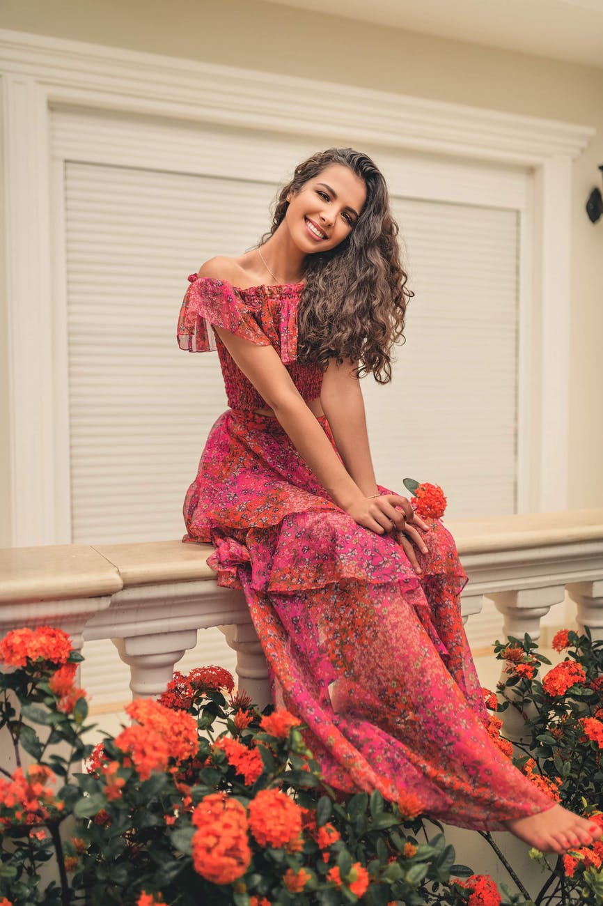 woman wearing long pink floral dress