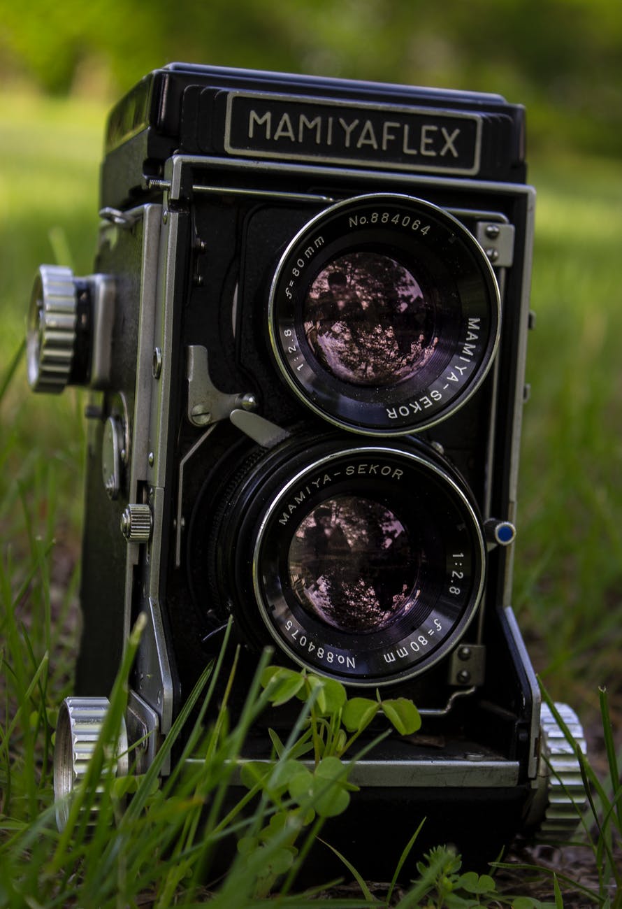 closeup of mamiya flex twin lens camera on grass