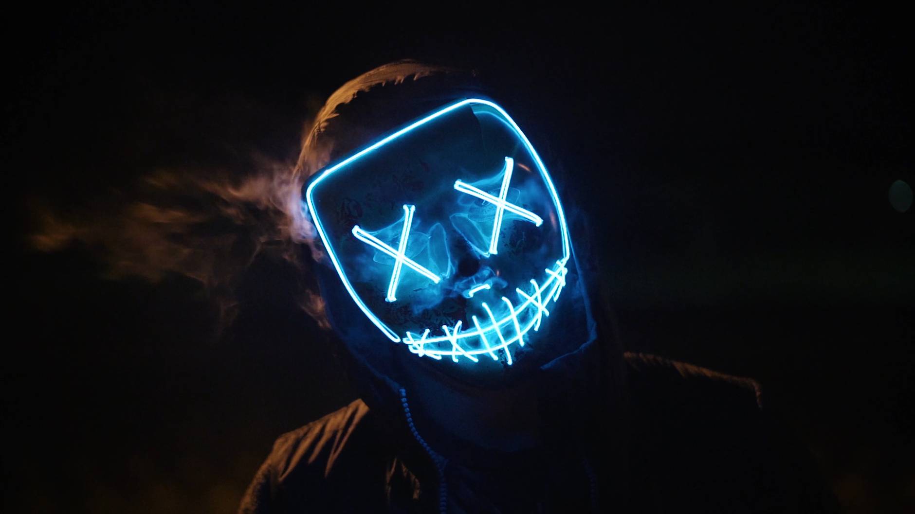 man wearing black and blue mask costume