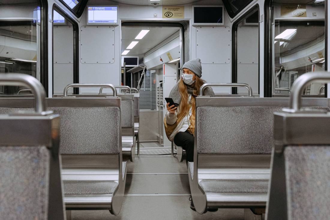woman wearing mask on train